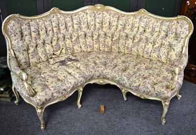 Lot 1298 - A 19th century white painted and parcel gilt corner sofa, in Louis XV style, recovered in...