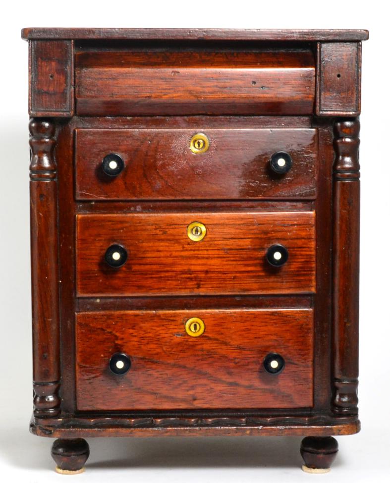 Lot 154 - A 19th century miniature four drawer chest