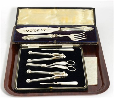 Lot 170 - A cased silver-plated set of nutcrackers, picks and grape scissors, by Manoah Rhodes & Son Ltd;...