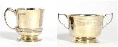 Lot 199 - A silver twin-handled Christening cup, by the Goldsmiths & Silversmiths Company, London 1934...