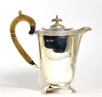 Lot 203 - A silver hot water jug, Sheffield 1938, with Celtic knot border, 20cm, 18.2ozt