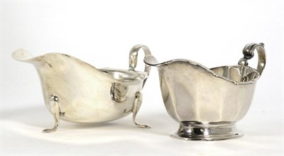 Lot 208 - A silver sauceboat, Mappin & Webb, Birmingham 1935; and another example, Viners, Sheffield...