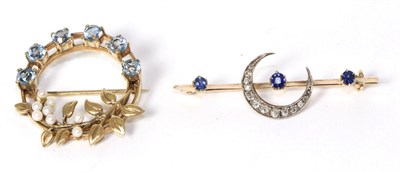 Lot 219 - A sapphire and diamond crescent bar brooch, total estimated diamond weight 0.25 carat...