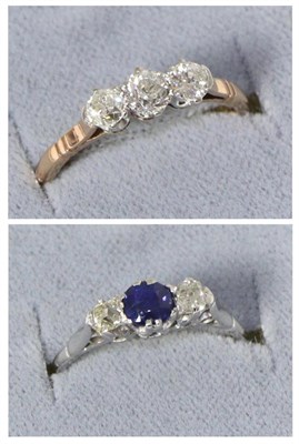 Lot 223 - A diamond three stone ring, graduated old cut diamonds in claw settings, total estimated...