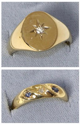 Lot 227 - A 9 carat gold star set diamond signet ring, estimated diamond weight 0.05 carat approximately,...