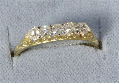 Lot 228 - An old cut diamond ring, five old cut diamonds in a carved setting, total estimated diamond...