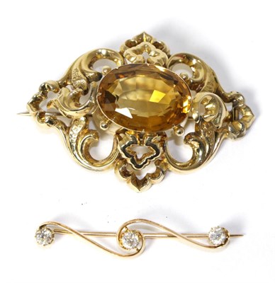 Lot 230 - A Victorian citrine brooch, an oval cut citrine in a scroll frame, measures 4cm by 5.2cm, in a...