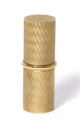 Lot 231 - A 9ct gold cylindrical lipstick/ holder with engine turned engraving