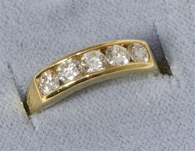 Lot 238 - An 18 carat gold diamond half hoop ring, five round brilliant cut diamonds in a channel...