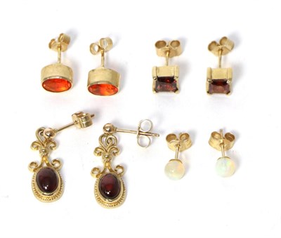 Lot 240 - A pair of 9 carat gold oval fire opal stud earrings, a pair of 9 carat gold square cut garnet...