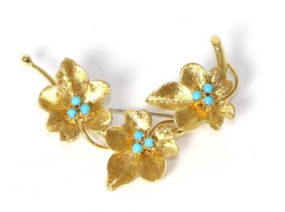 Lot 241 - An 18 carat gold turquoise spray brooch, three textured flower heads each set with three turquoise