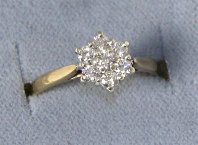 Lot 249 - A 9 carat gold diamond cluster ring, total estimated diamond weight  0.40 carat approximately,...