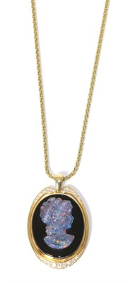 Lot 283 - An opal triplet, onyx and diamond cameo pendant, stamped '18CT' on a chain