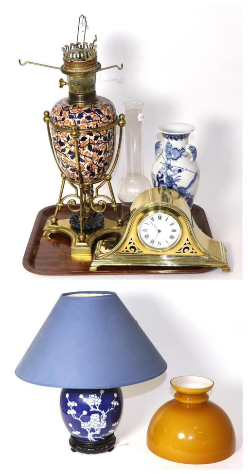 Lot 355 - Brass and Imari style pottery oil lamp; a Chinese blue and white vase; brass mantel clock; and...