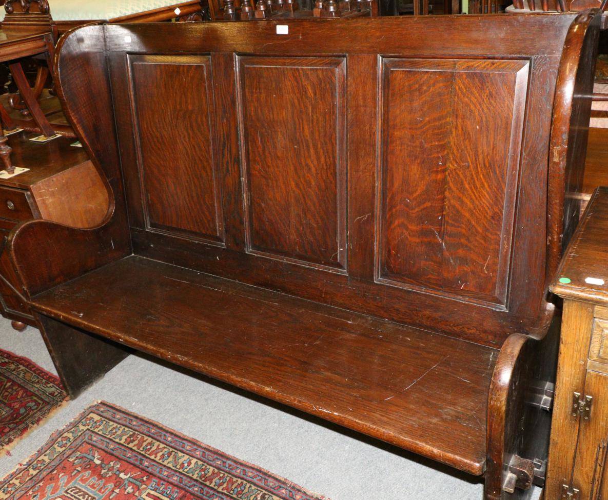 Lot 1280 - Panelled oak hall seat