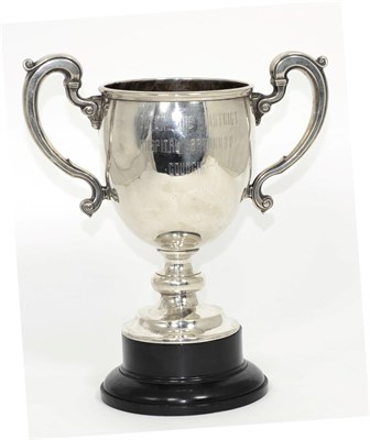 Lot 8 - A twin handled silver trophy cup, marks rubbed, probably Adie Bros, 1926, with associated...