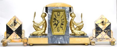 Lot 12 - An Art Deco marble striking mantel clock with garniture
