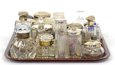 Lot 23 - A quantity of assorted silver topped glass jars and bottles; match strikers; and various metal...