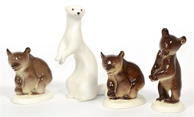 Lot 28 - Four Russian porcelain models, an ermine and three bear cubs