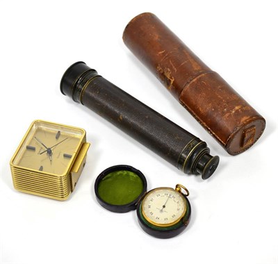 Lot 56 - A Negretti & Zambra pocket barometer and a leather cased three drawer telescope