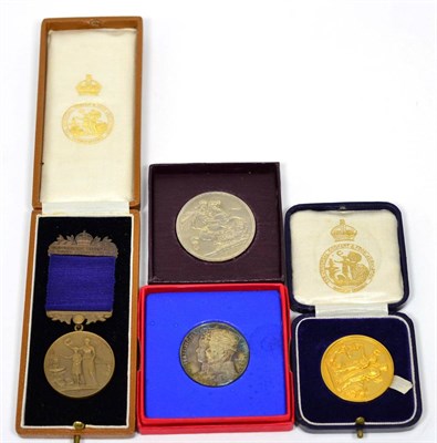 Lot 63 - A 9 carat gold Universal Cookery & Food Association medal, boxed; together with a 1935 Jubilee...