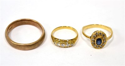 Lot 69 - An 18 carat gold diamond five stone ring, graduated round brilliant cut diamonds in a carved...