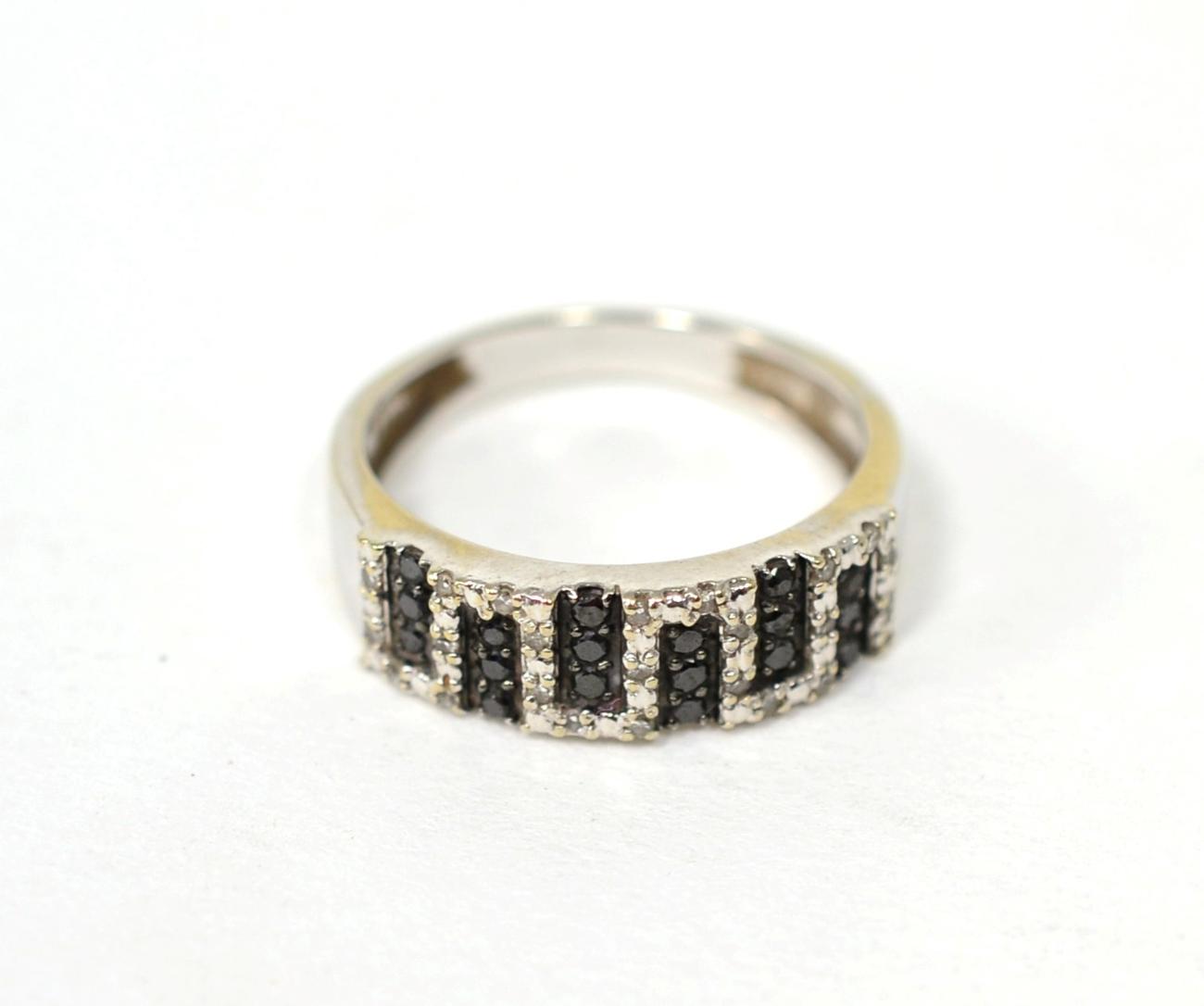 Lot 76 - A black and white diamond ring, the front pavé set with round brilliant cut black and white...