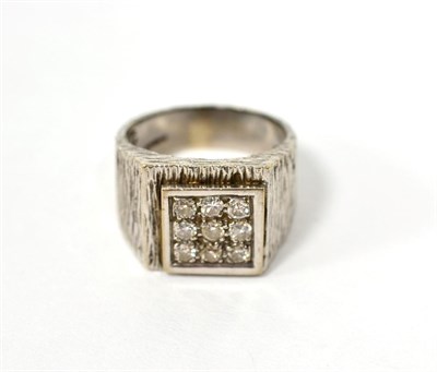 Lot 77 - An 18 carat white gold diamond cluster ring, a square top set with round brilliant cut diamonds...