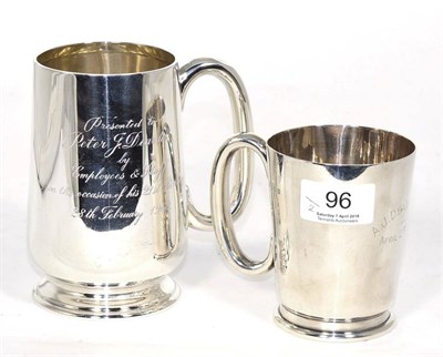 Lot 96 - A silver mug, William Neale, Birmingham 1938, inscribed and dated 1940; and a larger silver...