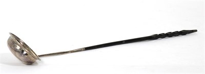 Lot 102 - A Georgian silver toddy ladle with baleen handle
