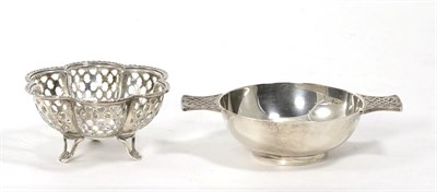Lot 105 - A Scottish silver quaich, with Celtic design handles and a pierced silver bon bon dish