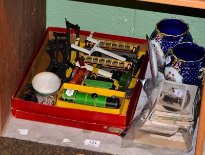 Lot 124 - Mettoy clockwork train set, original box; a collection of postcards; two items of early 19th...