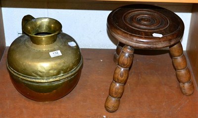Lot 132 - A 19th century brass jug together with a 19th century turned stool