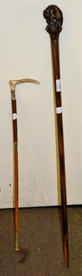 Lot 140 - A carved tiger wood stick together with a silver mounted riding crop