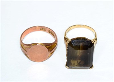 Lot 162 - A 9 carat gold smoky quartz ring, an octagonal cut smoky quartz in a claw setting, to forked...
