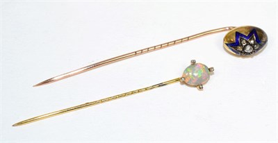 Lot 164 - A diamond and enamel stick pin, an egg-shaped top inset with rose cut diamonds within a blue enamel