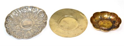 Lot 165 - An early 19th century French silver gilt paten, engraved IHS, maker's mark EG; a German lobed...