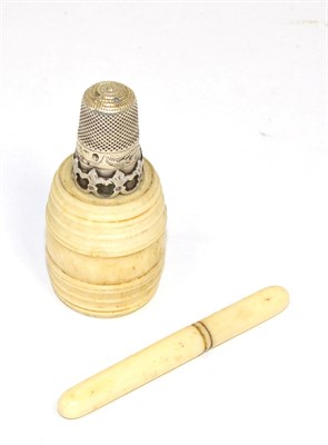 Lot 177 - An ivory barrel, with screw thread opening to reveal a silver thimble; and an ivory needle case...
