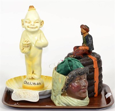 Lot 213 - A Wilkinson novelty ashtray, 'The Chairman'; a tobacco jar and cover modelled as an Arab sitting on