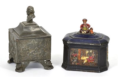 Lot 214 - A lead tobacco jar and cover, decorated with tiger hunting scenes, the cover with Shakespeare...