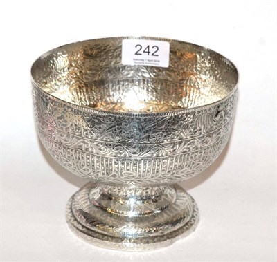 Lot 242 - An Islamic metalware pedestal bowl, tests silver, decorated with bands of animals, stylised...