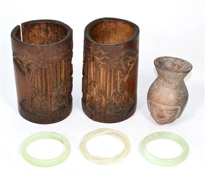 Lot 293 - Three jade bangles, pair of bamboo brush pots and pre-Columbian style head