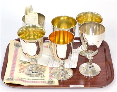 Lot 334 - A group of six 20th century silver commemorative goblets, various makers; Mappin & Webb, Barker...