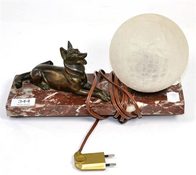 Lot 344 - A French Art Deco table lamp with spelter Alsatian on marble slab base