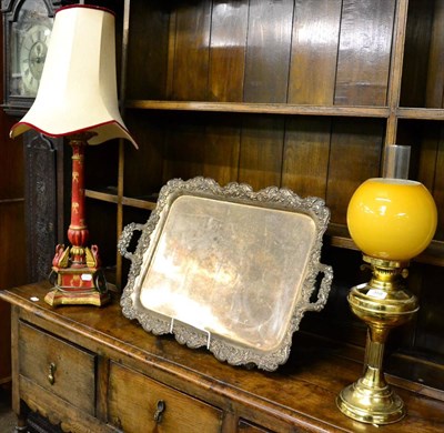 Lot 358 - A painted and parcel gilt carved wooden table lamp, together with a brass oil lamp