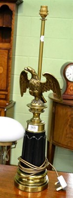 Lot 365 - A brass table lamp with eagle and fluted column support