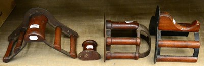 Lot 1025 - A set of four various Musgrave patent cast iron and mahogany harness racks, late 19th century