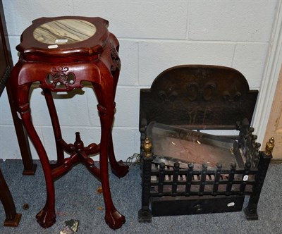 Lot 1036 - A Chinese marble inset plant stand and a cast iron fire grate with fleur-de-lis decorated back...