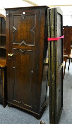 Lot 1046 - An oak hall cupboard