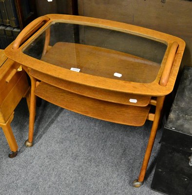 Lot 1058 - A Danish style hostess trolley with lift off glass tray